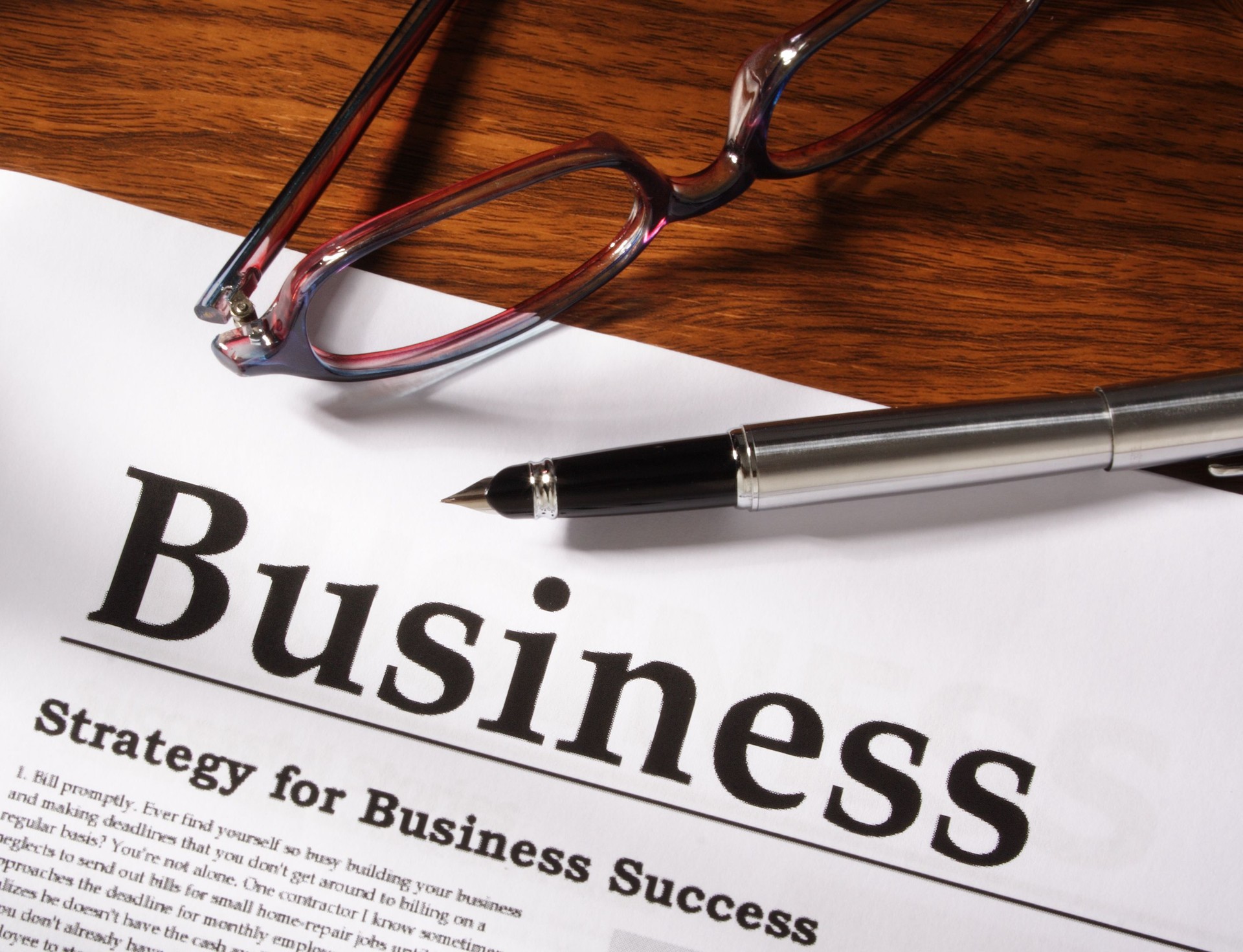 Pen, Glasses and Business File on Table